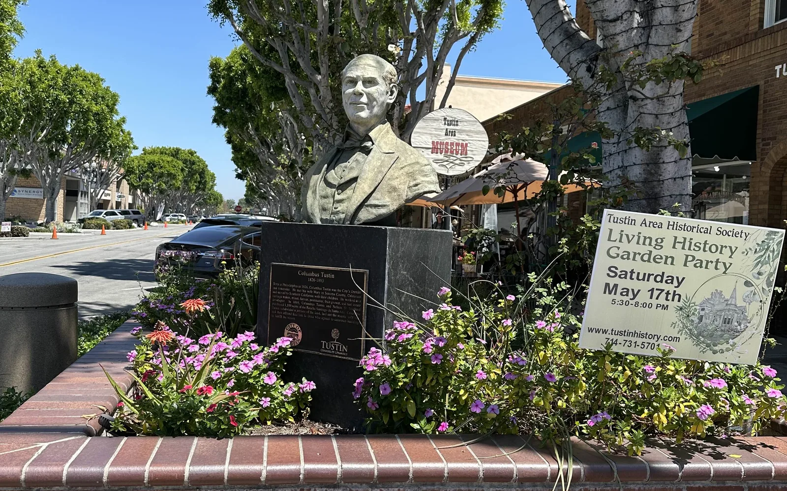 Bronze bust sculpture of Tustin's founder on Main Street, showing the city's historic downtown heritage
